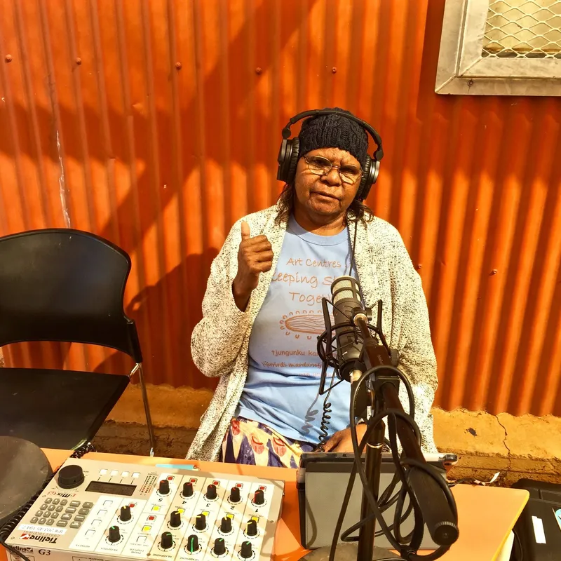 Broadcaster at the Umuwa studio microphone